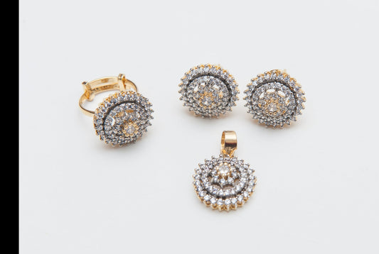 Jewelry set with earrings and a pendant on a light gray background